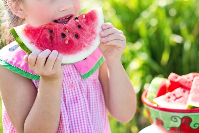 Child-eating-watermelon-during-summer-weather-in-the-Netherlands