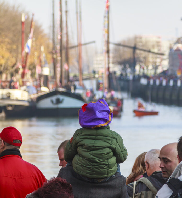 Photo-of-Sinterklaas-parade-with-child-on-parent's-back
