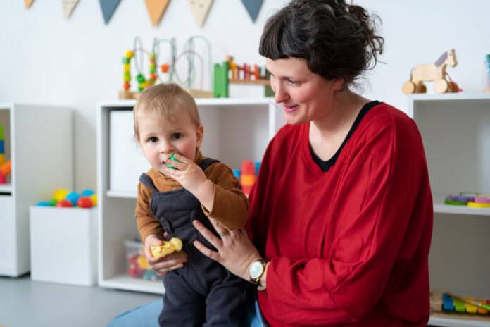 photo-of-woman-holding-child-upright-parent-in-the-Netherlands