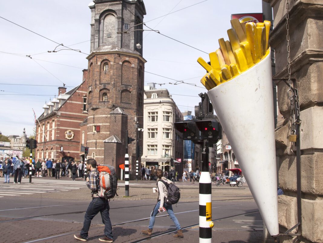 photo-of-exterior-of-chip-shop-in-amsterdam-with-people-walking-past