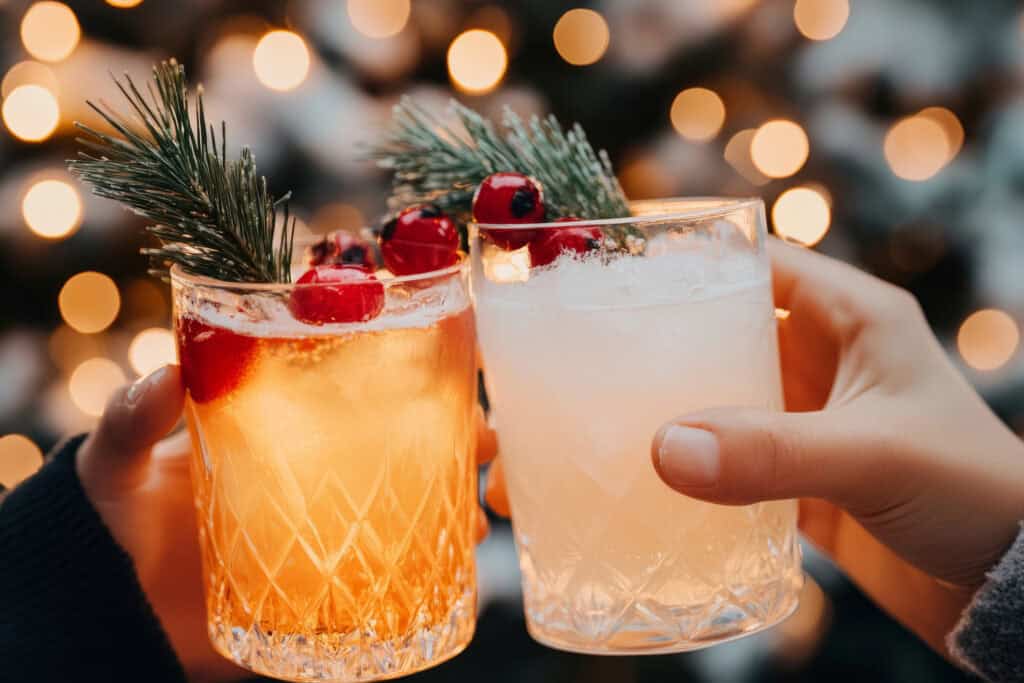 two-friends-cheering-with-festive-cocktails-as-they-celebrate-the-christmas-season-in-the-netherlands