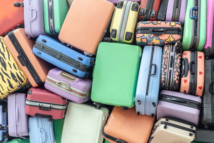 photo of travel suitcases stacked on top of each other