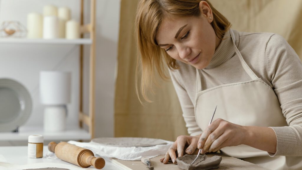 close-up-woman-taking-a-pottery-class-in-the-netherlands