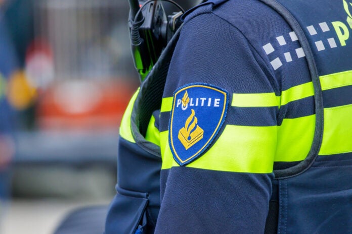 closeup-dutch-police-officer-with-politie-badge-on-shoulder