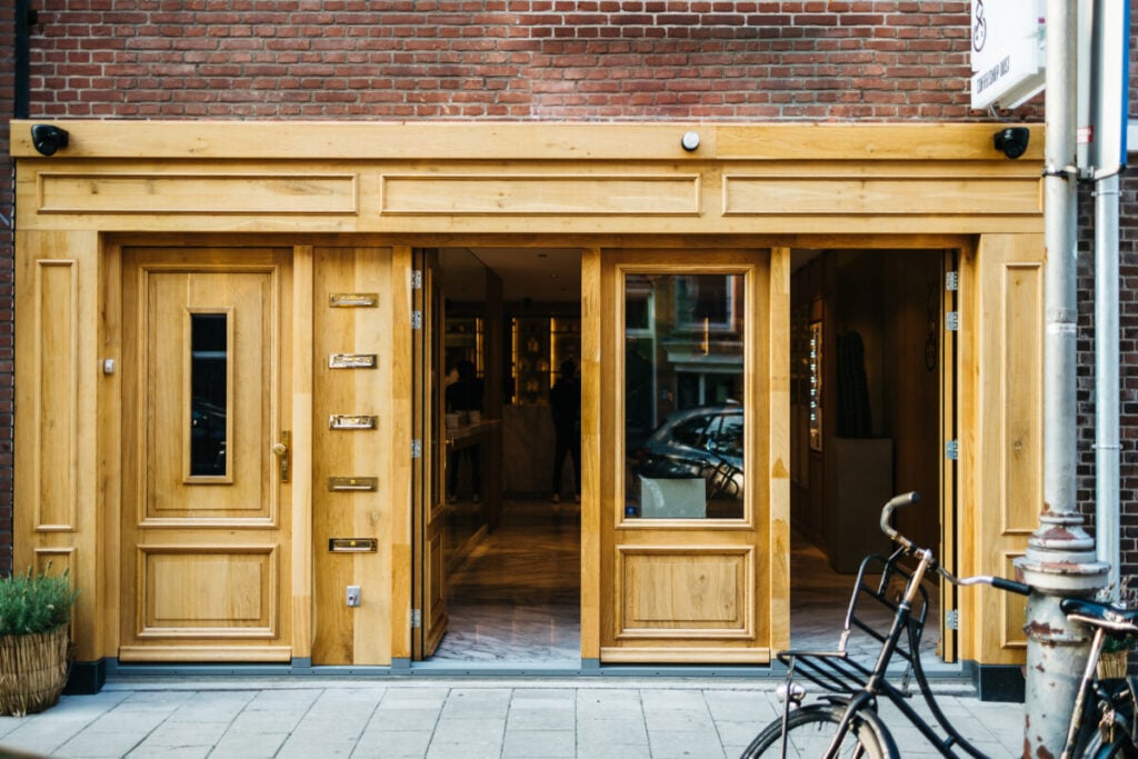 coffeeshop-oost-in-amsterdam-exterior-wooden-doors-at-entrance