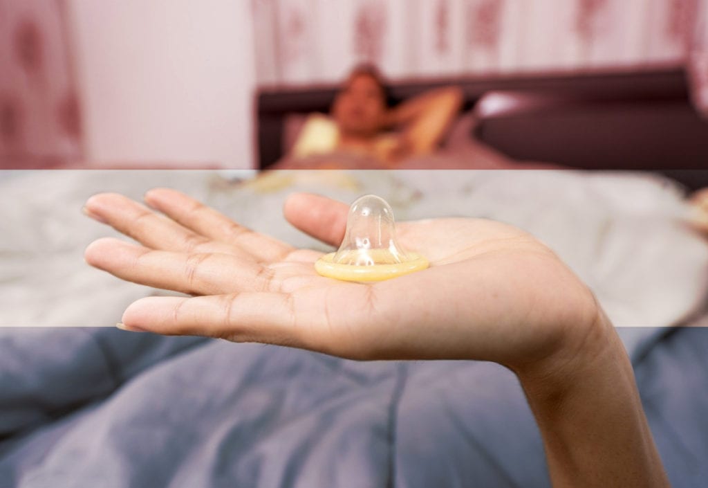 Dutch-person-holding-a-condom-to-have-sex-in-the-Netherlands