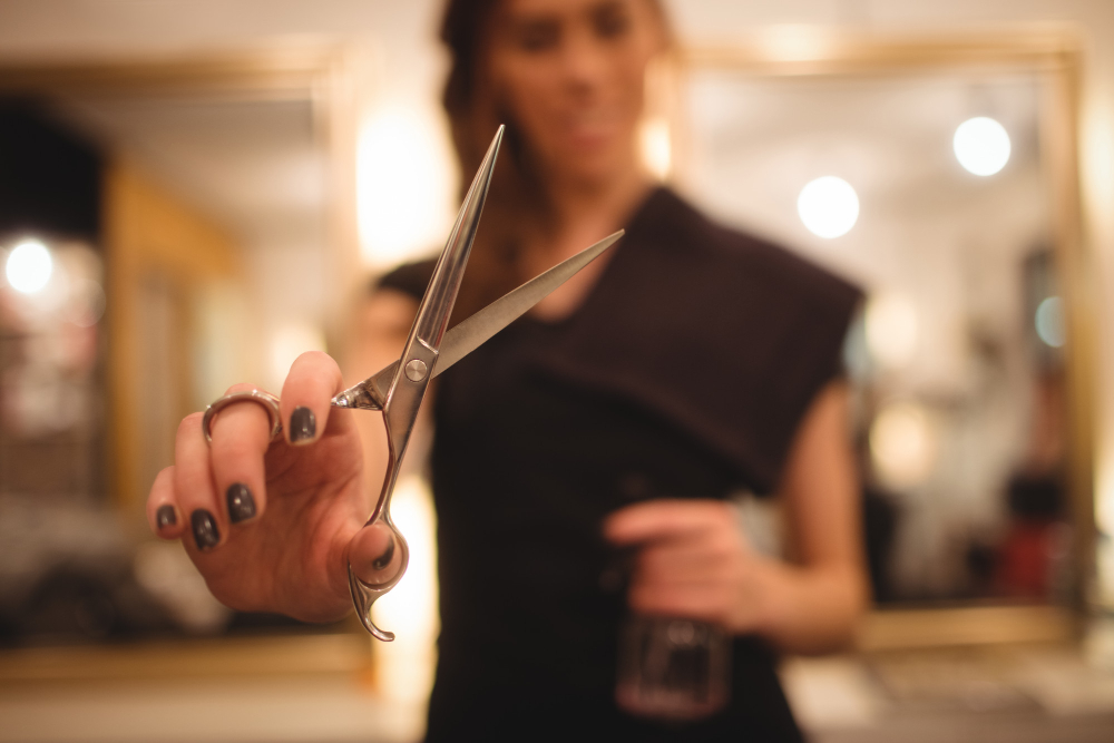 photo-of-hairdresser-holding-scissors