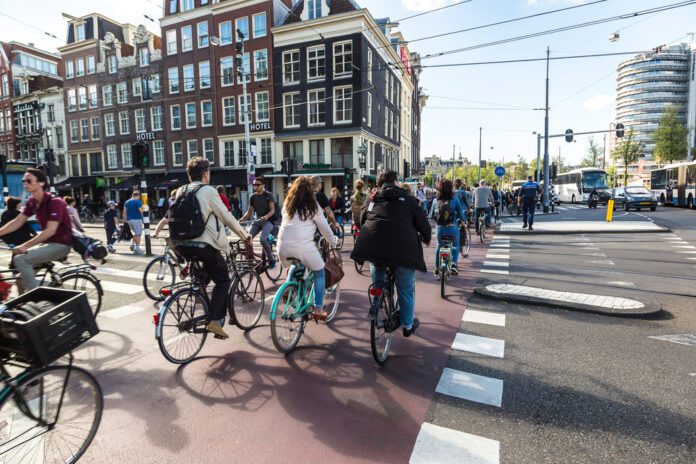 photo-of-cyclists-on-bike-path-in-amsterdam