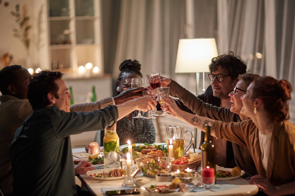 photo-of-friends-having-dinner-in-the-netherlands-toasting
