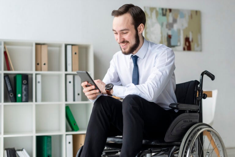 photo-of-disabled-man-in-the-netherlands-banking-using-phone