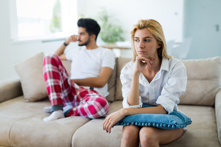 photo-of-divorcing-couple-on-couch-in-netherlands-thinking-about-getting-a-divorce-in-the-Netherlands