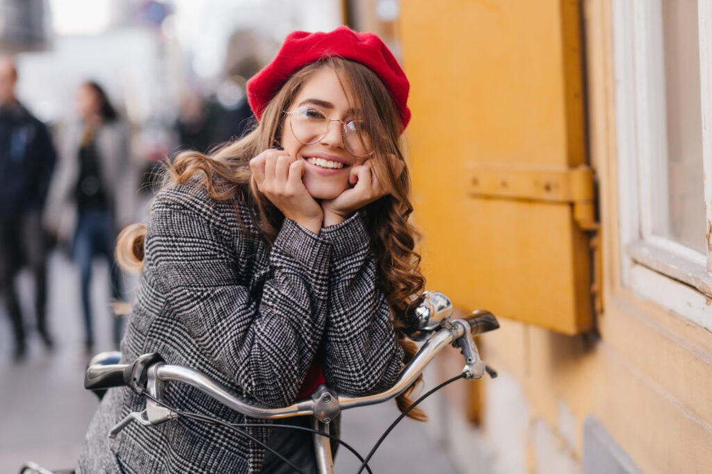photo-of-typical-dutch-girl-smiling-leaning-on-bike