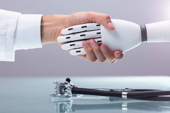 doctor-with-white-lab-coat-shaking-robot-hand-over-a-desk-and-stethoscope