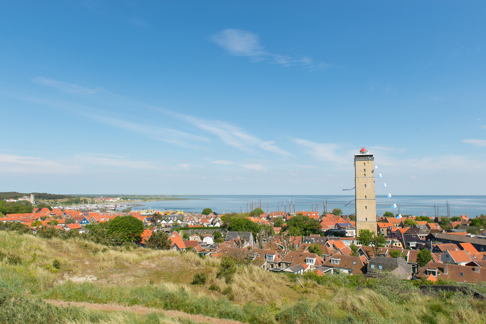 Dutch-village-with-lighthouse-at-island-Terschelling-dutch-wadden-island-in-the-netherlands