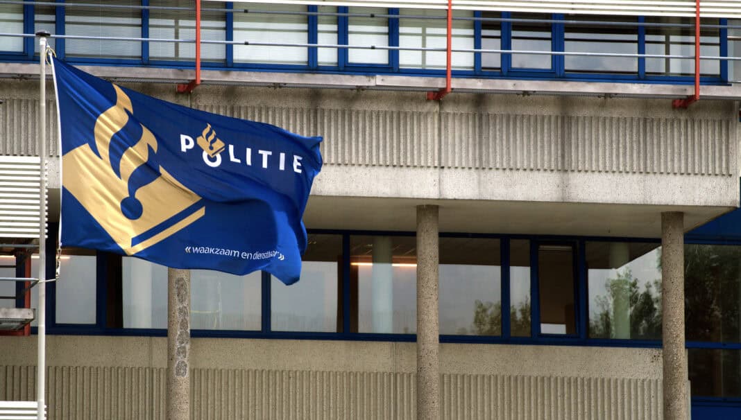 dutch-police-station-exterior-with-police-flag-in-foreground