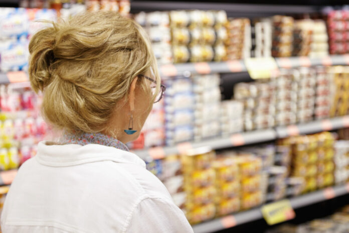 photo-of-woman-in-supermarket-buying-eggs