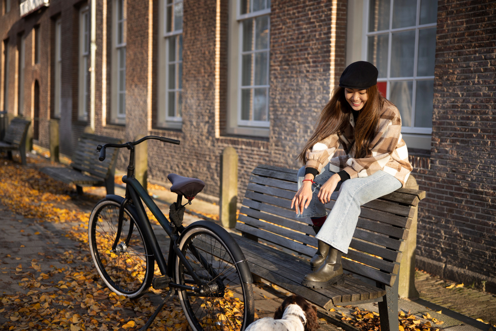 photo-of-woman-sitting-on-bench-next-to-refurbished-e-bike-from-upway-Netherlands