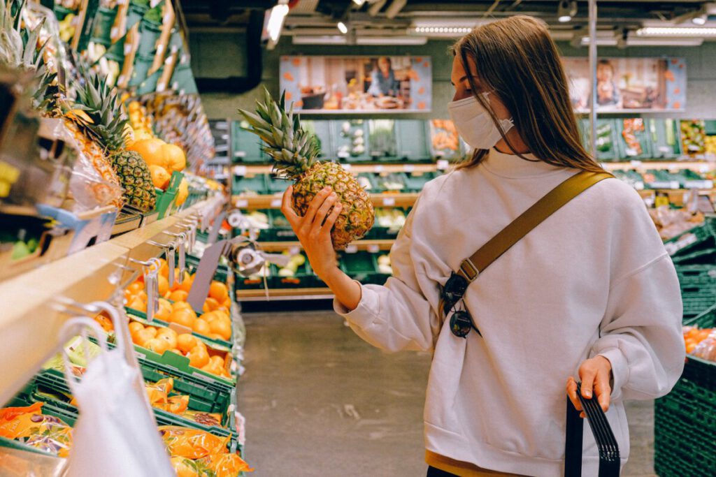 photo-young-woman-wearing-a-mask-while-shopping-fair-trade-in-the-netherlands