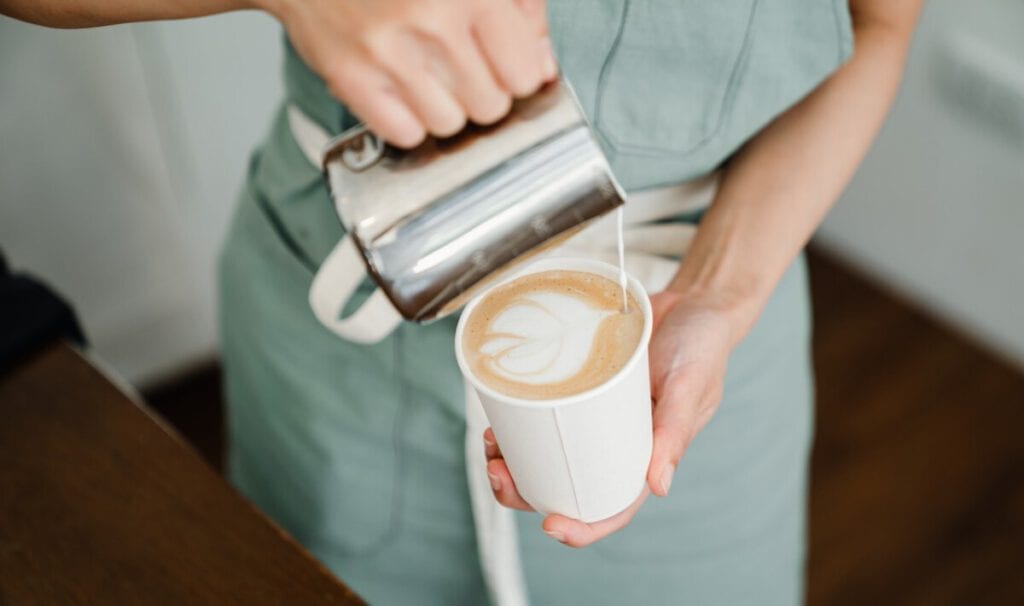 photo-barista-making-latte-art-with-fair-trade-coffee-in-the-netherlands