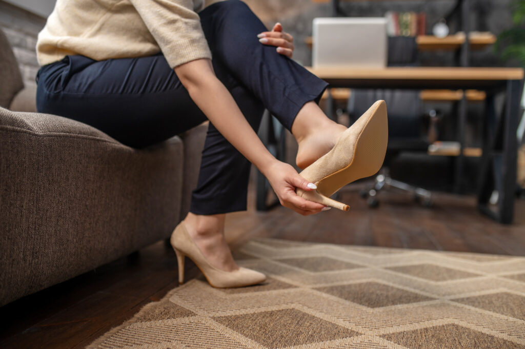 Female-wearing-heels-in-her-home- sitting-down