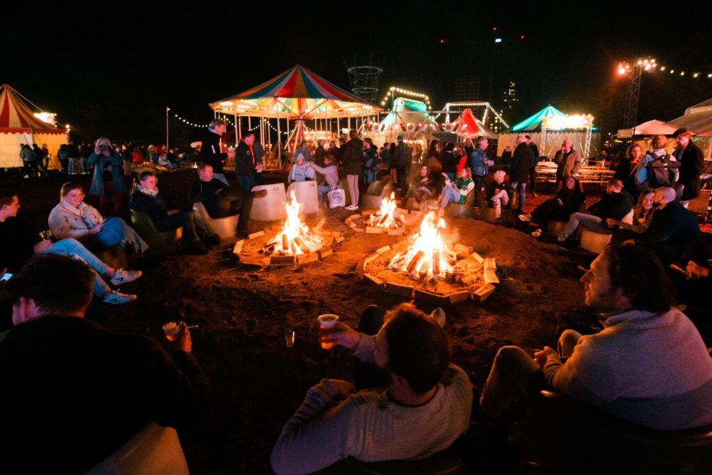 photo-of-festival-circolo-people-sitting-around-bonfire-at-night