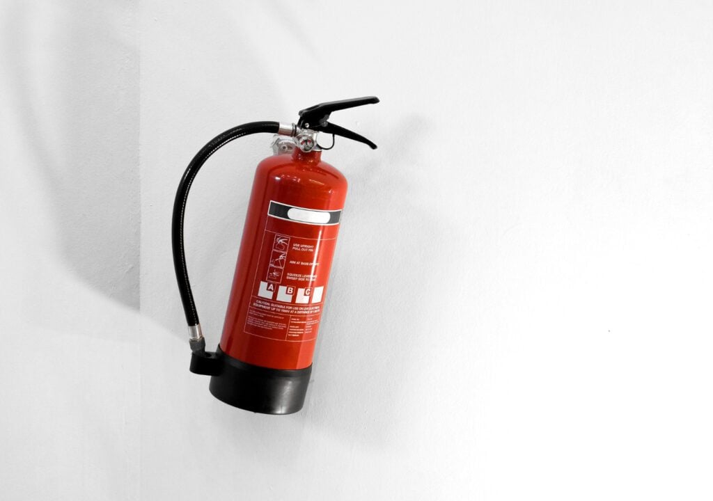Red-fire-extinguisher-mounted-to-the-wall-in-case-of-house-fires-in-Netherlands