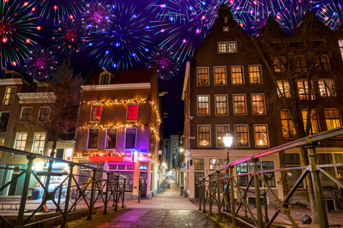 photo-of-fireworks-above-typical-amsterdam-houses