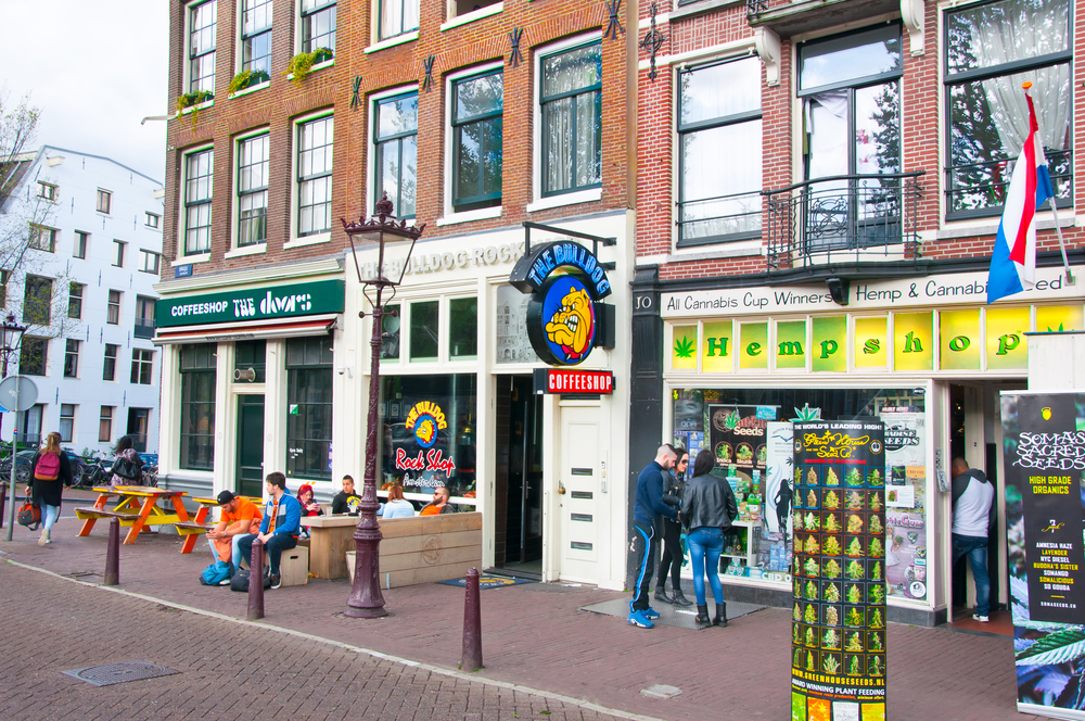 amsterdam-red-light-district-street-with-people-standing-outside-coffeeshops