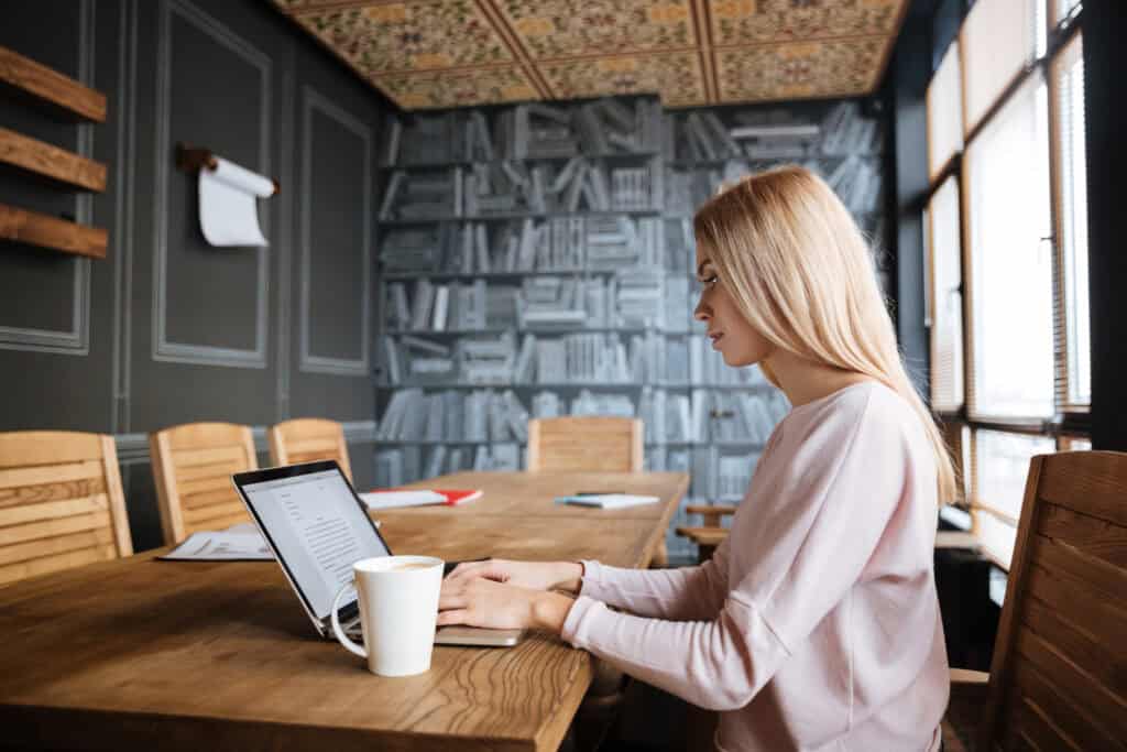 freelancer-in-the-netherlands-completing-work-assignment-on-laptop-in-a-coworking-space