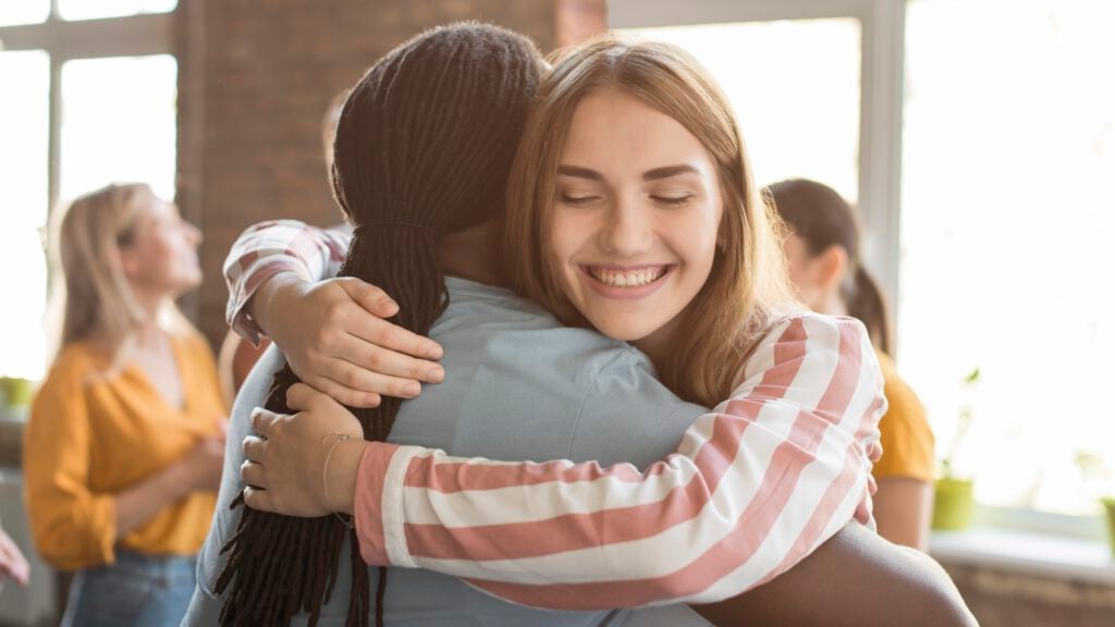 photo-of-friends-hugging-each-other-when-of-them-is-moving-to-the-netherlands