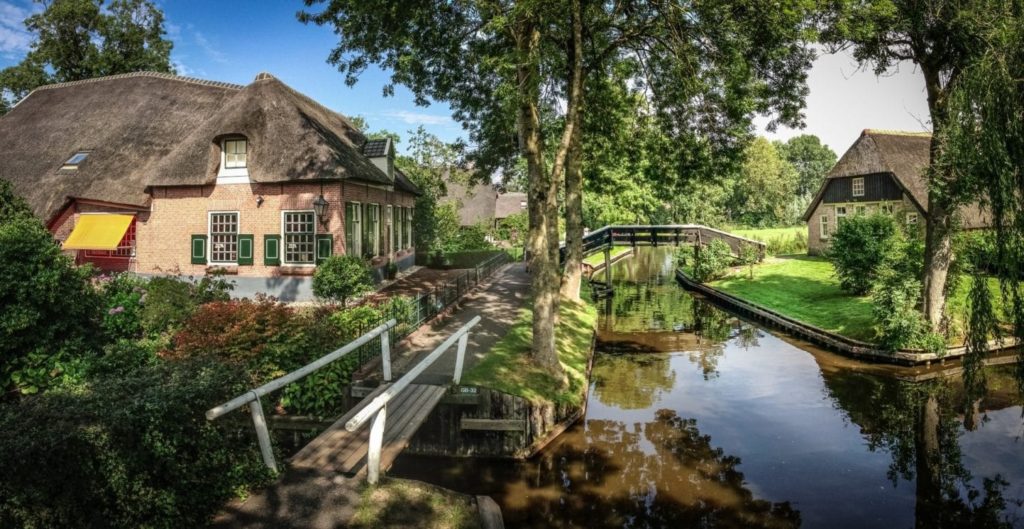 photo-of-view-of-canals-and-bridges-next-to-houses-in-giethoorn-tourist-traps-netherlands