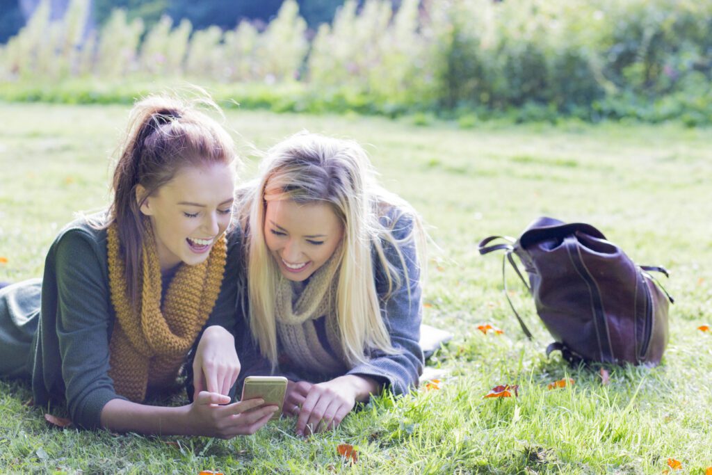 girls-relaxing-in-amsterdam-park-while-high-after-smoking-weed