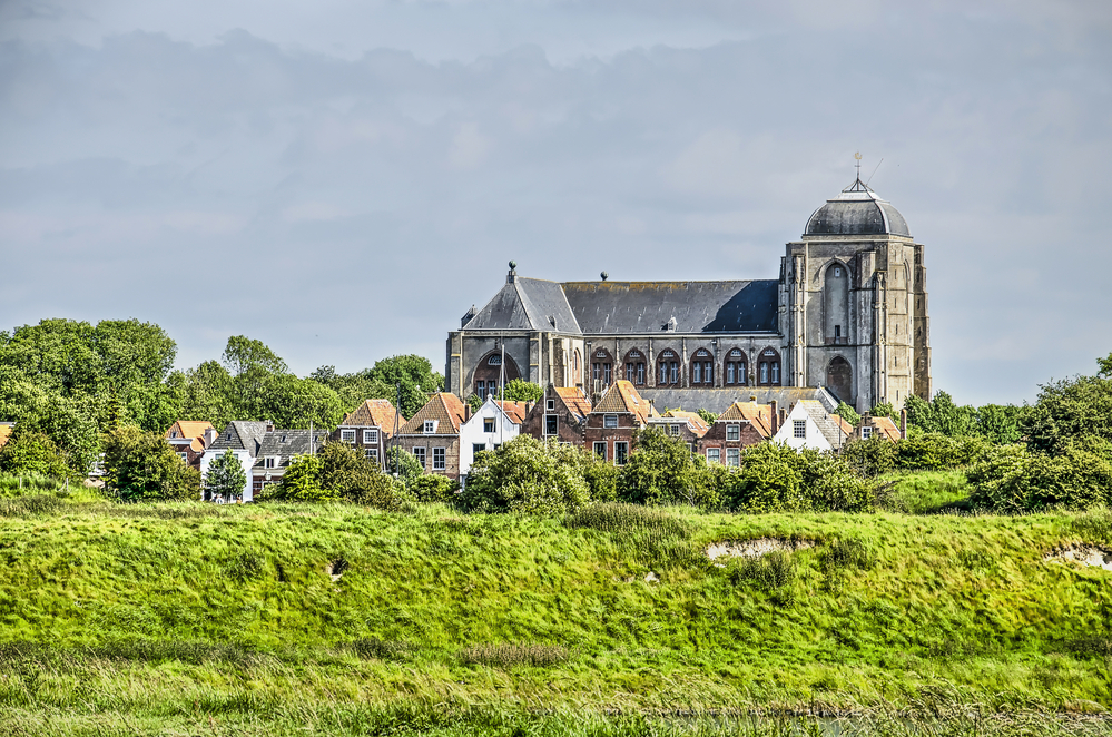 photo-of-gothic-church-with-greenery-in-dutch-city-veere