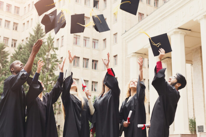 A-group-of-graduates-throwing-graduation-caps-in-the-air-in-the-netherlands