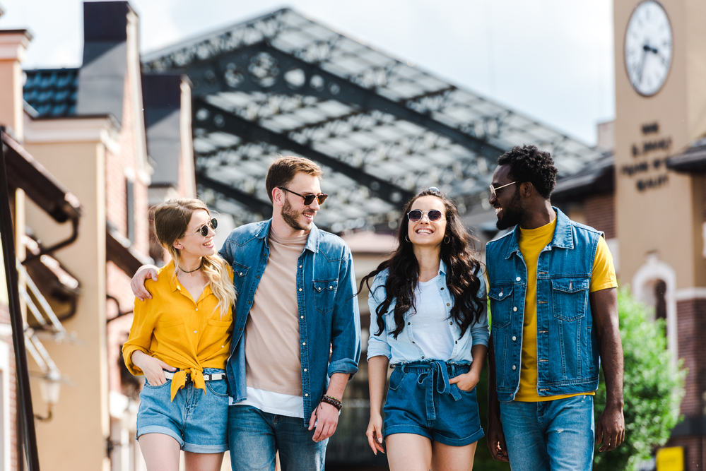 group-of-people-walking-close-together-on-sidewalk