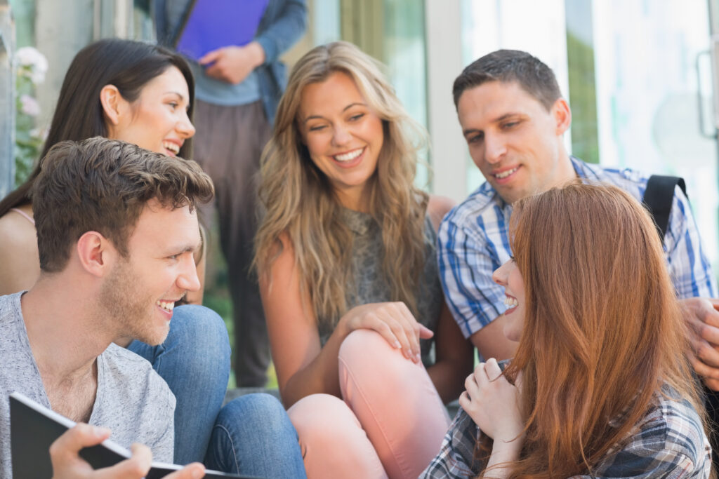 Group-of-young-people-together-looking-at-one-person-specifically