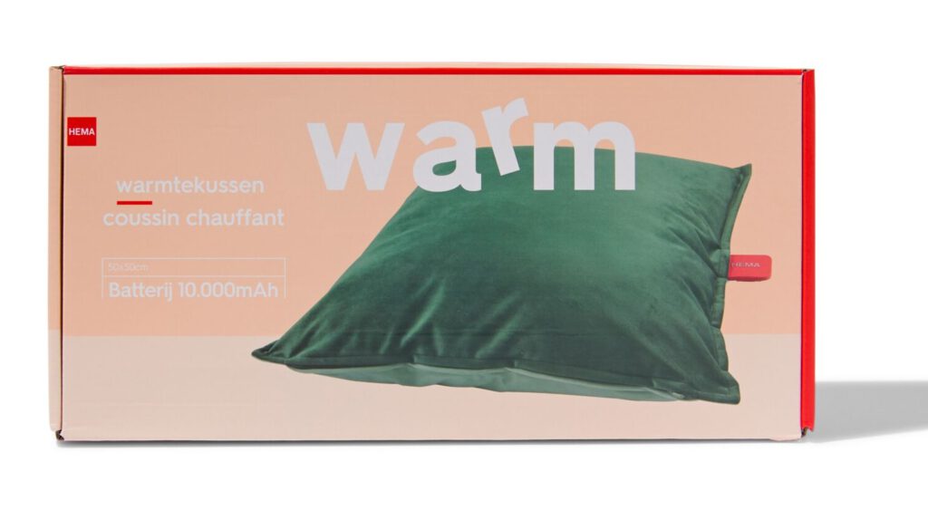 product-photo-of-hema-heatable-cushion-in-a-pink-box-with-the-words-warm-on-the-front