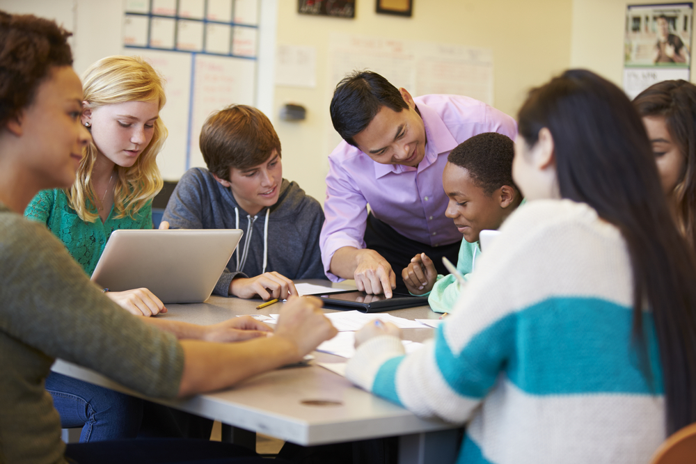 international-high-school-students-in-the-netherlands-sitting-in-a-circle-using-AI-tools-in-education