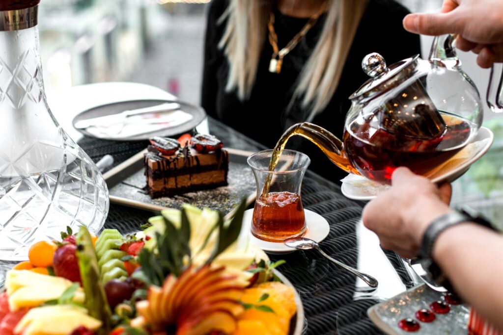 photo-of-tea-being-poured-in-a-glass-during-high-tea-in-amsterdam
