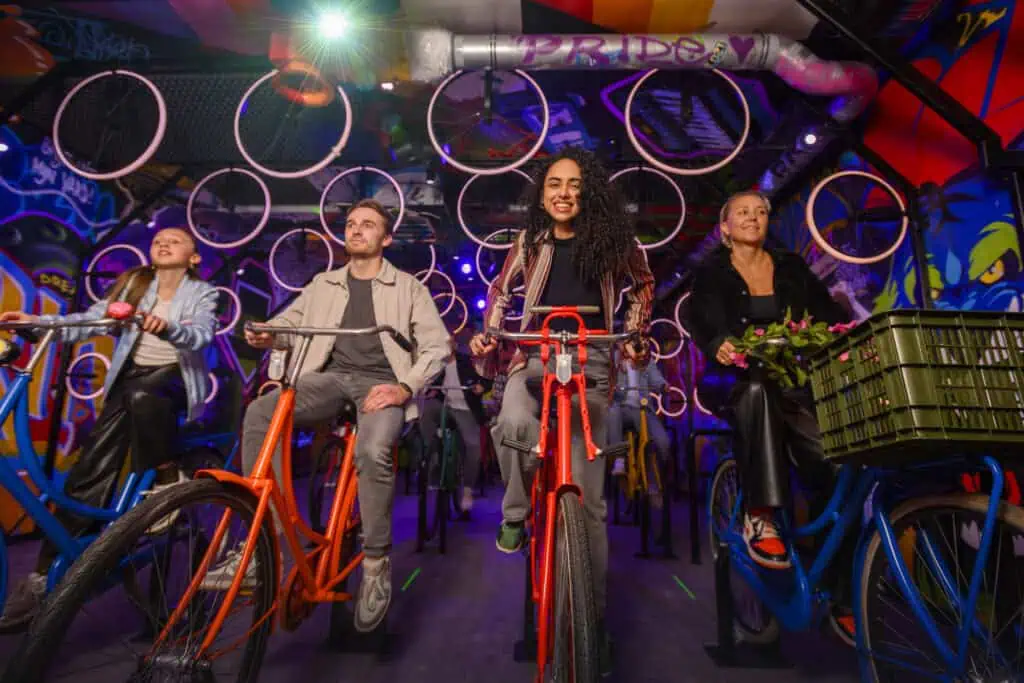 photo-of-a-group-of-frineds-on-indoor-bicycles-at-highlights-of-holland-in-amsterdam