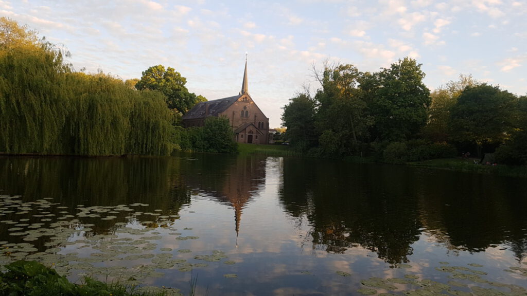 photo-of-picturesque-small-dutch-town-lake-and-church-for-hiking-in-the-Netherlands-during-winter