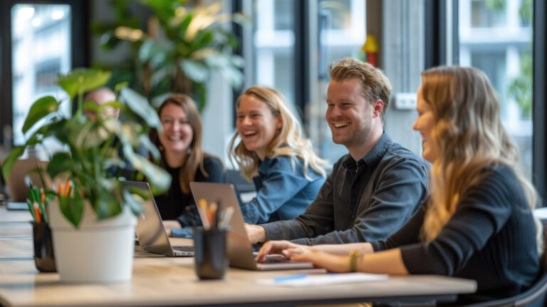 photo-of-employees-in-netherlands-smiling-and-talking-about-sponsored-jobs-with-plants-in-background