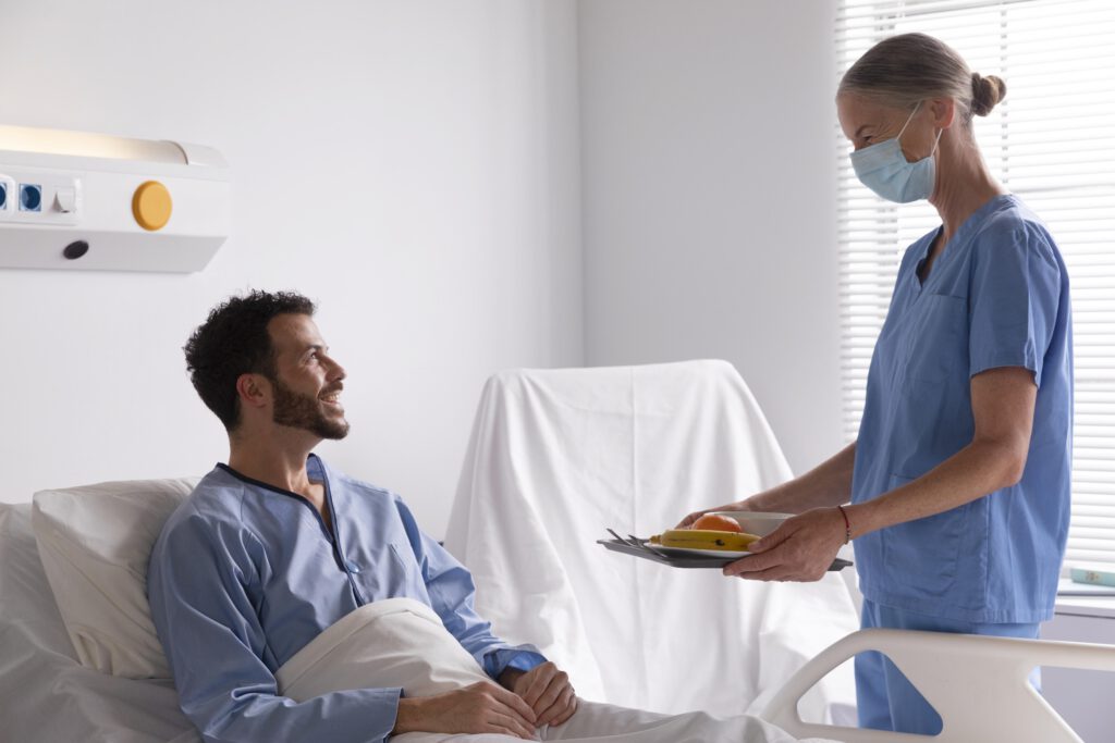 international-in-hospital-smiling-as-dutch-nurse-brings-him-breakfast