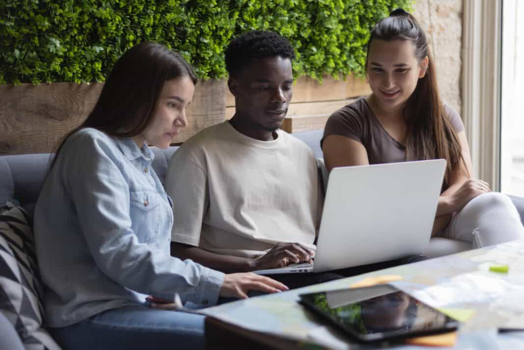 international-students-at-a-dutch-university-working-on-a-project-together-with-laptop-open