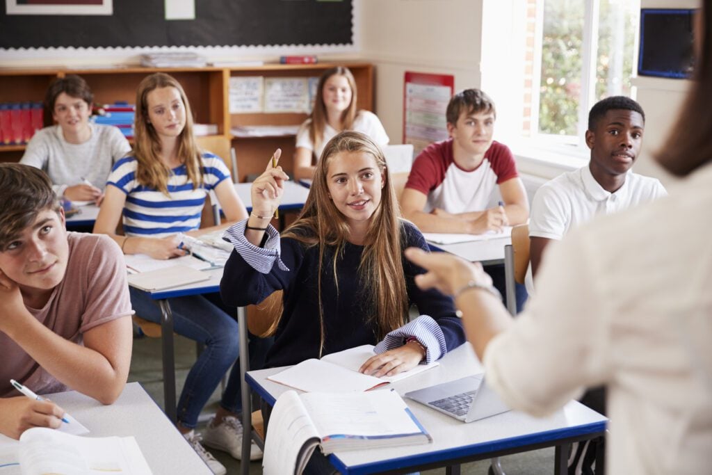 international-female-student-raising-hand-to-ask-question-in-classroom-in-the-netherlands