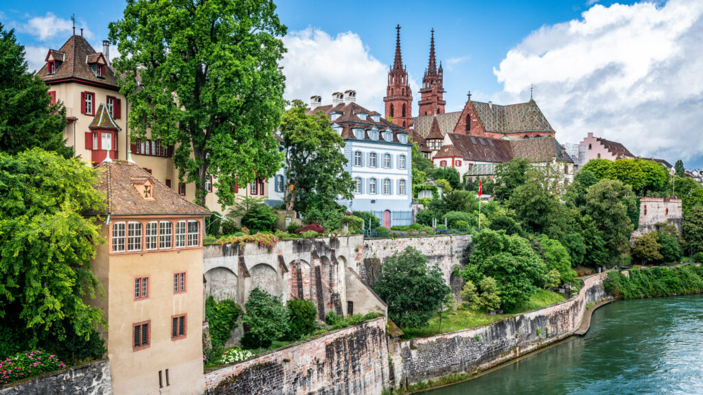 Basel cityscape panorama with colourful old town skyline and houses along Rhine river banks in Basel Switzerland, reachable by international train form the Netherlands