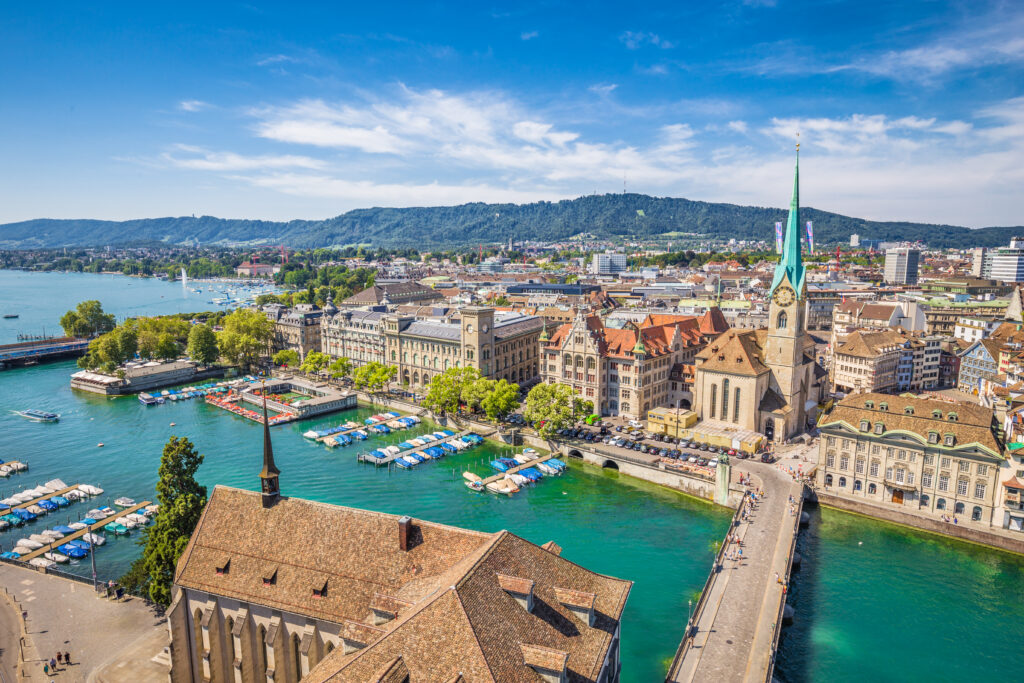 Aerial view of Zurich city center with famous Fraumunster Church and river Limmat at Lake Zurich from Grossmunster Church. Easily accessible by international train from Amsterdam