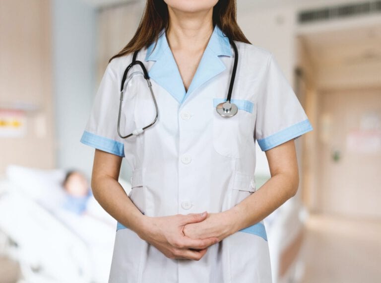 photo-of-female-nurse-standing-in-uniform-in-netherlands