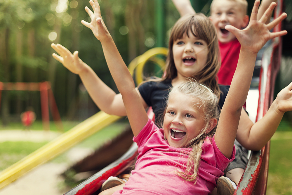 kids-playing-on-swing-while-being-raised-in-the-Netherlands