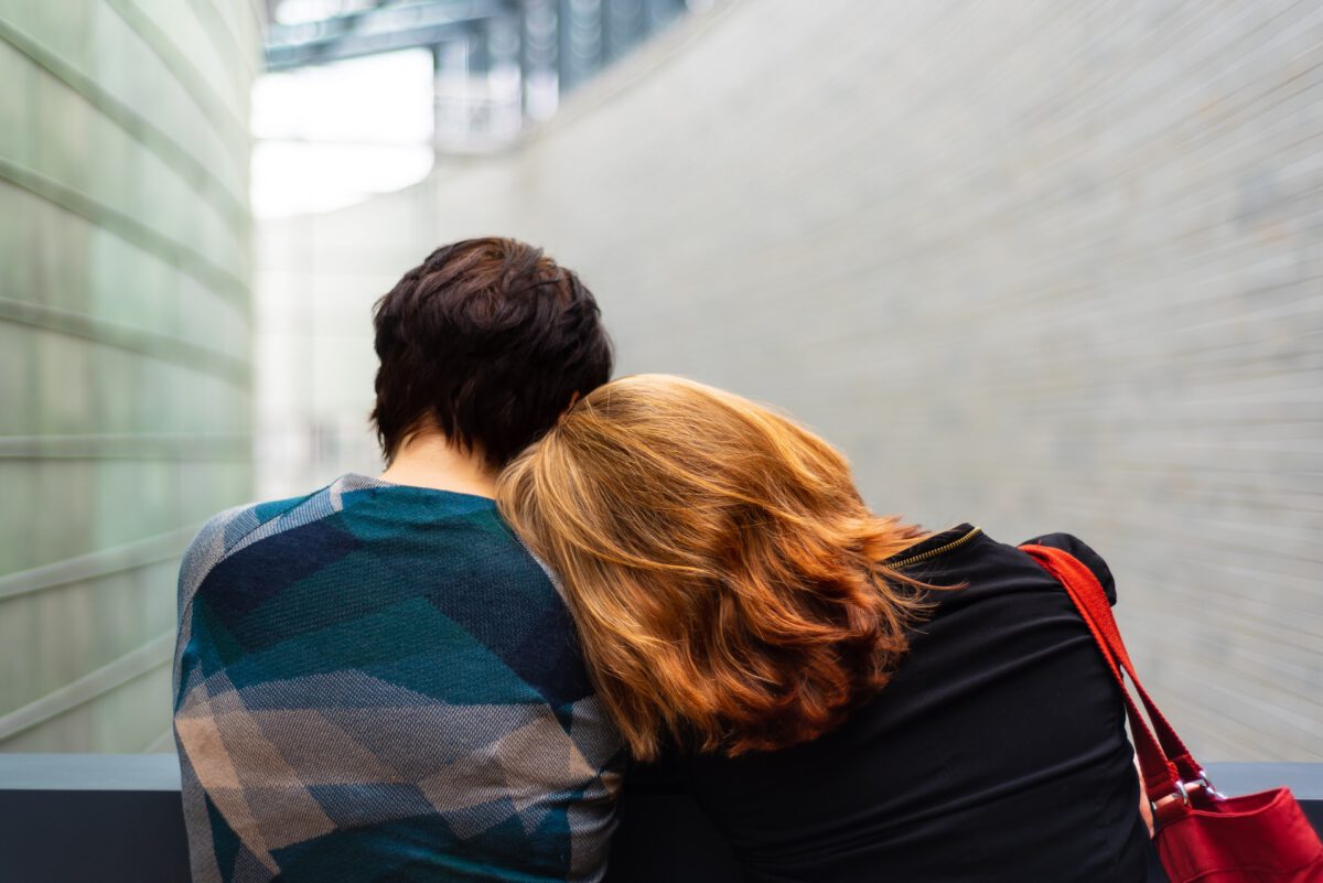 Photo-of-woman-leaning-head-on-man's-shoulder